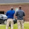 Home inspector with homeowner explaining the home inspection's findings